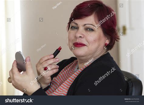 Attractive Mature Woman Applying Red Lipstick Stock Photo Shutterstock