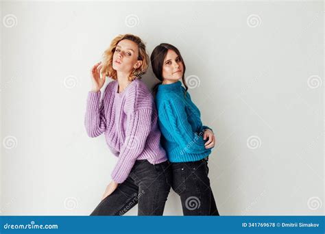 Two Women Blonde And Brunette Posing On A White Background Stock Photo Image Of Breast Girl