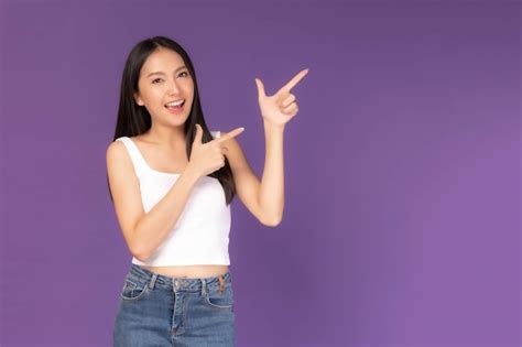 Premium Photo Beautiful Asian Brunette Woman Cute Girl In White Tank Top Smiling And Pointing