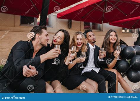 Attractive Brunette Girl Gently Strokes Boyfriend S Hair And Looking Into His Eyes While Her