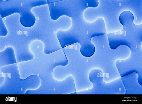 Jigsaw puzzle pieces as background in closeup Stock Photo - Alamy