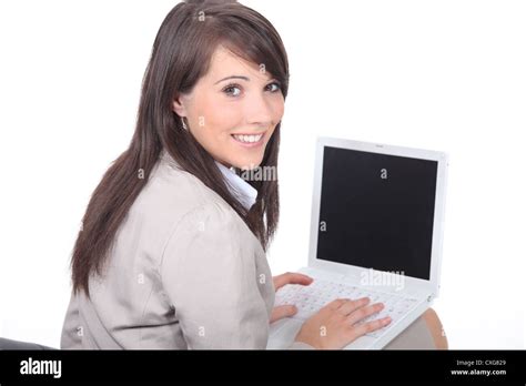 Brunette Working On Laptop Computer Stock Photo Alamy