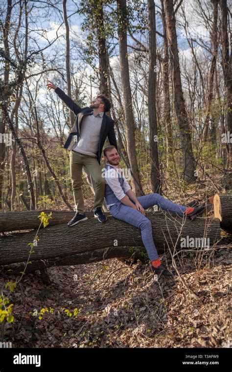 Two Men Carefree Gay Couple Looking To Camera Posing Outdoors In