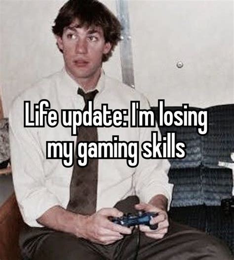 A Man Sitting On A Couch Holding A Video Game Controller In His Hand