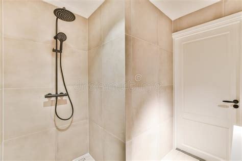 Interior Shot Of A Bathroom With Nude Colored Tiles On The Walls Stock Image Image Of Living