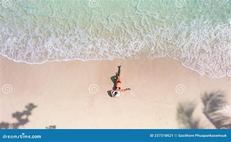 Top View Of Woman In Red Bikini And Relaxation As Lying On Sand During Summer Vacation Which