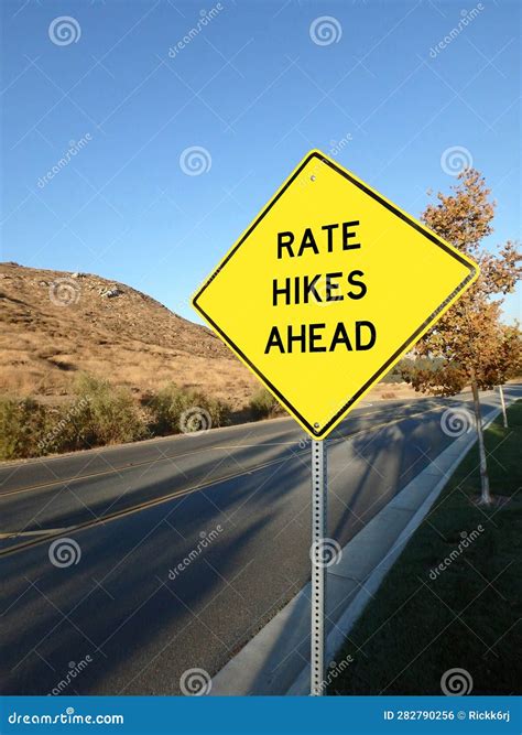 Yellow Roadside Warning Sign Warning of Interest Rate Hikes Ahead