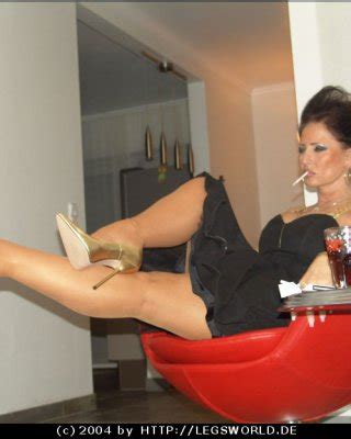 Kinky Smoking Lady In Stockings And Golden High Heels Porn Pictures XXX Photos Sex Images