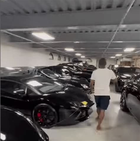 Floyd Mayweather Flaunts Over 50 All-Black Cars In His Garage (VIDEO)