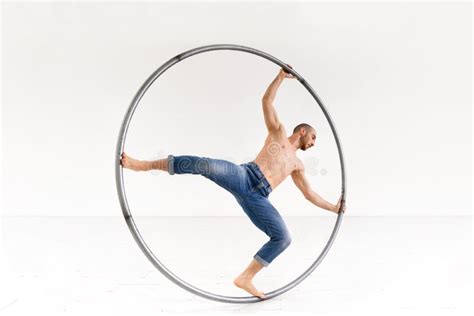 Shirtless Man Spinning On Cyr Wheel Stock Photo Image Of Naked Acrobatic