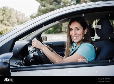 Smiling Young Woman Driving Car Stock Photo Alamy