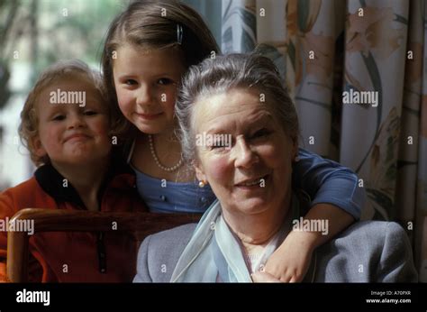 Grandmother Smiling With Her Grandchildren Stock Photo Alamy