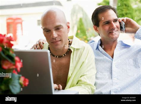Middle Aged Gay Couple Using Technology Stock Photo Alamy