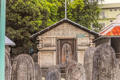 Premium Photo A Small Cemetery With A Small Building With A Sign That