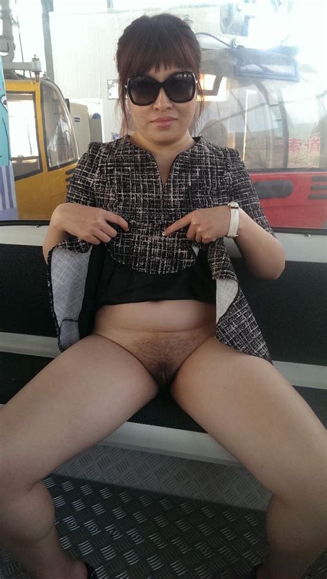 In A Short Dress Inside A Library And Showing Her Pussy