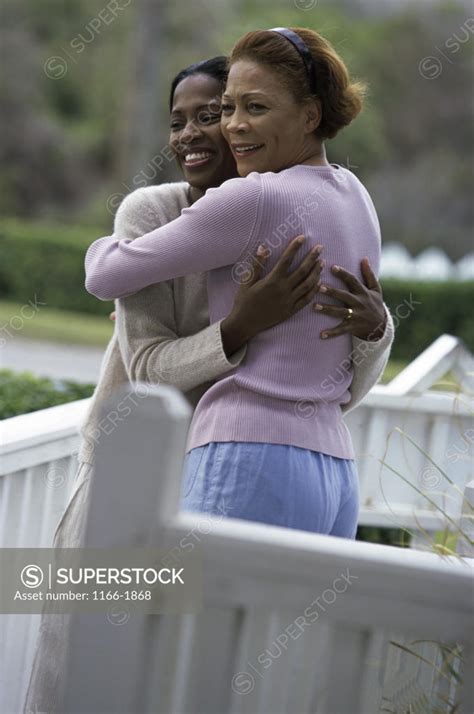 Mature Woman Hugging Her Daughter SuperStock