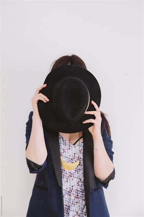 Stylish Woman Holding Hat By Stocksy Contributor Carey Shaw Stocksy