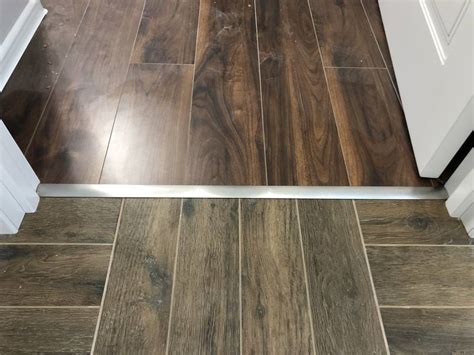 Стык плитки и ламината — варианты и способы оформления