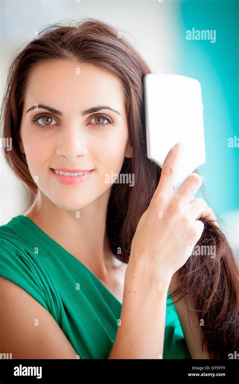Woman Brushing Her Hair Stock Photo Alamy