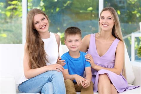 Premium Photo Lesbian Mothers With Foster Son At Home Adoption Concept