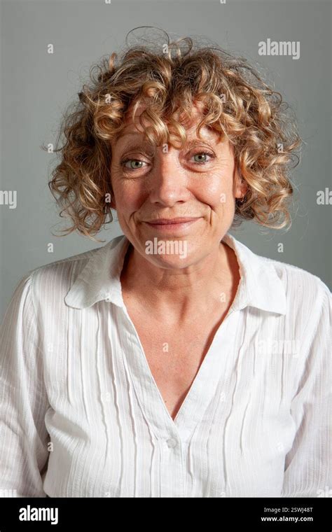 Mature Expressions Forced Smile From A Series Of Expressive Portrait Images Of A Mature Female