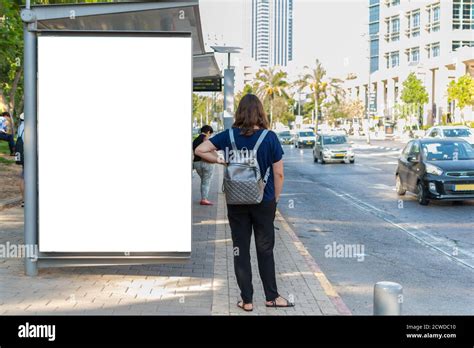 Empty Kiosk Advertising Mockup At A Bus Stop On An Avenue Kiosk Add
