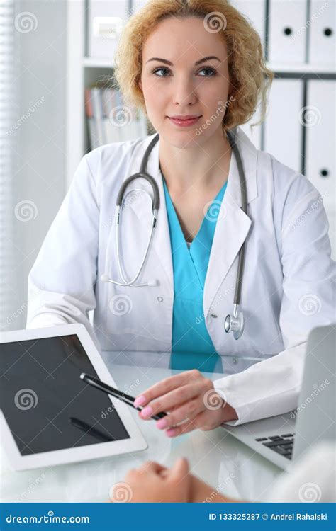 Happy Blonde Female Doctor And Patient Discussing Medical Examination Results Medicine