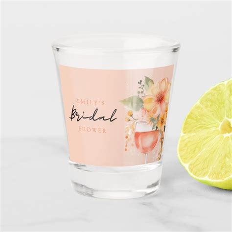 A Shot Glass Next To A Lemon On A White Surface With The Words Bridal Shower