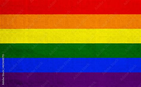 Flag Of The LGBT Community On The Background Of A Fabric Texture Rainbow Symbol Of Gay Culture
