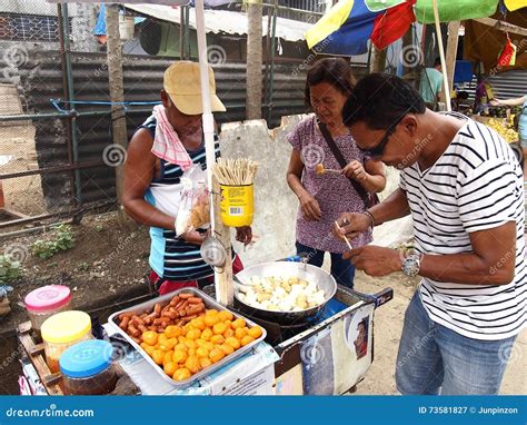 A Food Vendor Cooks Fish Balls, Sausages and Quail Eggs Which he Sells
