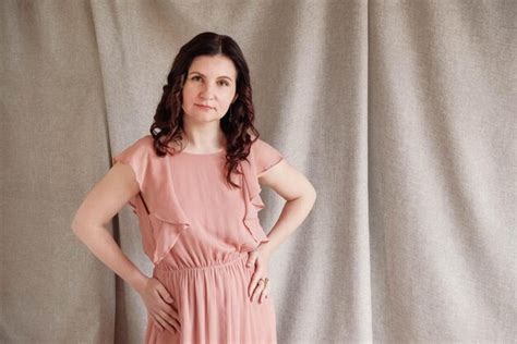 Premium Photo Beautiful Brunette Woman In A Pink Dress On A Background Of Linen Fabric Copy