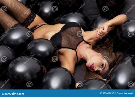 Beautiful Woman In Black Lingerie Surrounded With Black Balloons Stock Photo Image Of Human