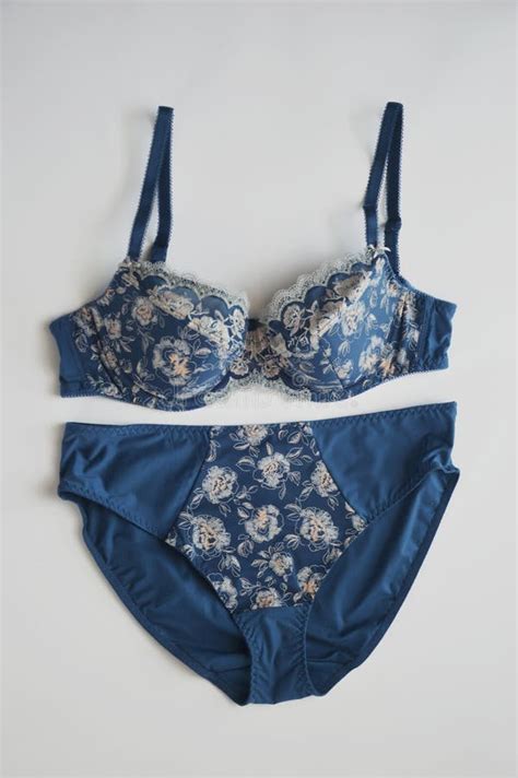 Lingerie Set Blue Silk Panties With A Pattern And A Bra On A White Background Beautiful