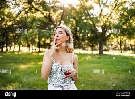 Portrait Of Blonde Woman With Cigar In Outdoor Stock Photo Alamy