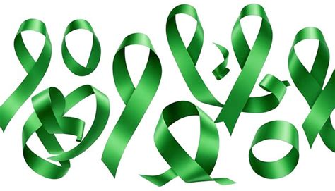 A green ribbon with a symbol that says green on it | Premium AI ...