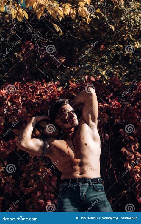 Naked Man Holding Creepy Carved Halloween Pumpkin Portrait Of A Horrible Scary Zombie Man Stock