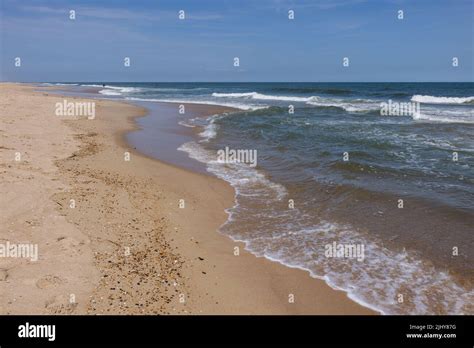 Waves Lapping Against The Beach At Delaware Seashore State Park Near