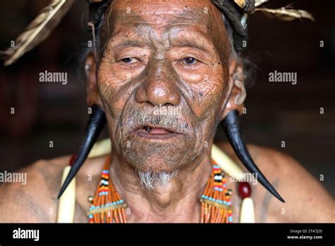 Portarit of an elder, a man from a konyak tribe with traditional tribal ...