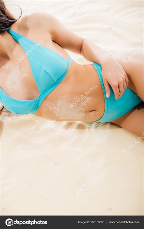 Cropped View Sexy Girl Blue Bikini Covered Sand Lying Beach Stock Photo Vitalikradko