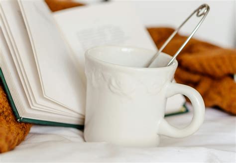 Coffee and book on comfortable bed · Free Stock Photo