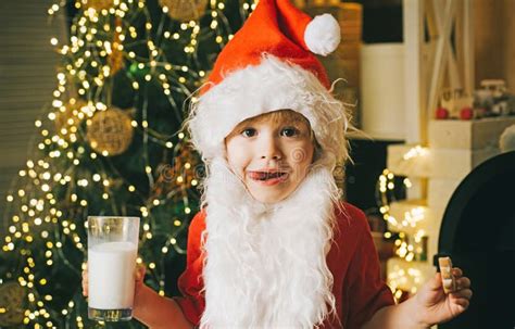 Santa Child Eating Cookies And Drinking Milk Christmas Food And Drink