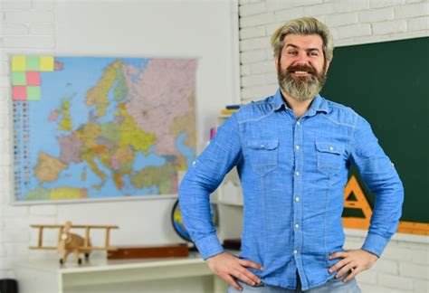 Premium Photo School Subject History And Geography Science Concept Mature Bearded Teacher In