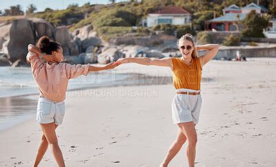 Couple Holding Hands On Beach Lesbian And Fun By Ocean Gay Women Outdoor With Adventure And