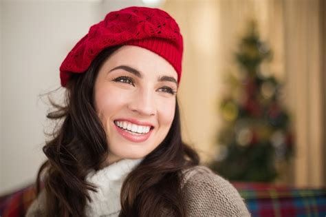 Premium Photo Smiling Brunette On The Couch At Christmas
