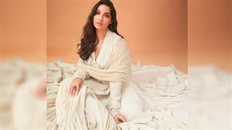 Photos Nora Fatehi Raises Temperature In Nude Thigh High Slit Dress Hindustan Times
