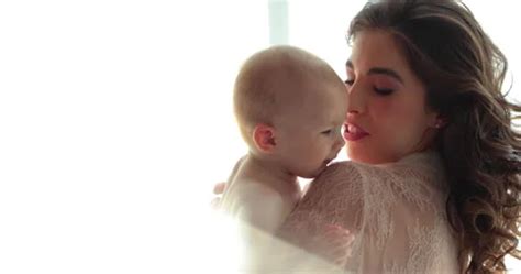 A Beautiful Mother Holds A Small Naked Stock Video Pond5