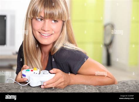 Blonde Woman Playing Video Games Stock Photo Alamy