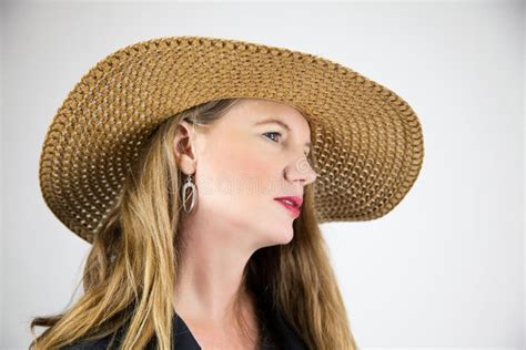 Closeup Portrait Mature Blonde Female Hat And Black Coat Stock Image