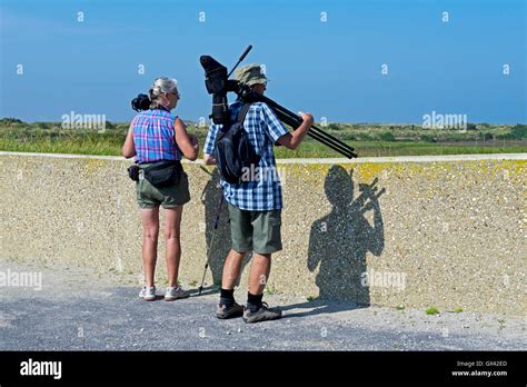 Bird Watchers At Rspb Titchwell Nature Reserve North Norfolk England