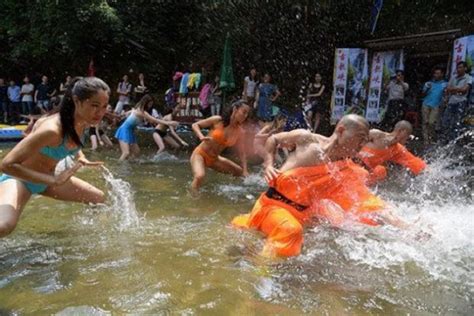 Bikini Lifeguards At China Rafting Attraction Train With Shaolin